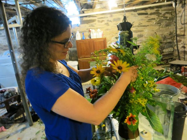 Talitha arranging wedding flowers
