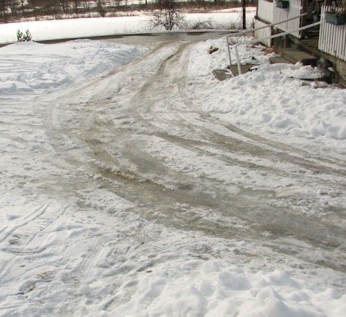 Image of long, sloping, icy driveway