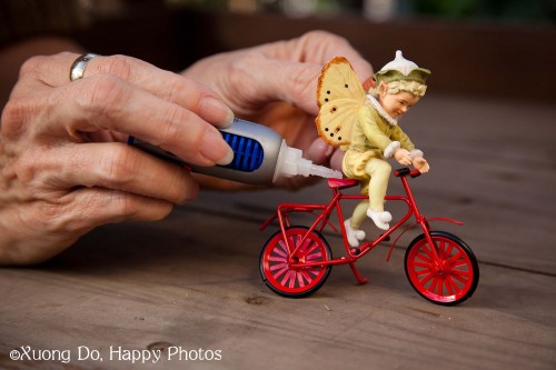 miniature fairy Boy glued on Bike