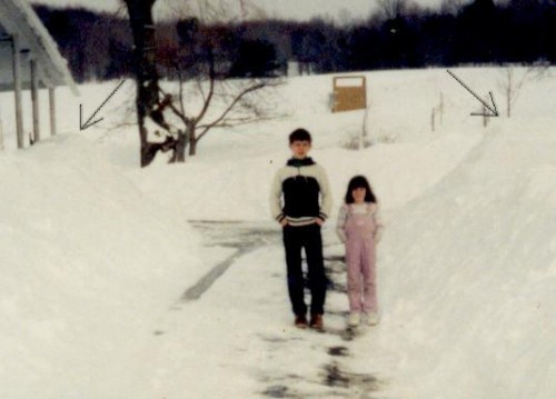 Titi and Rundy standing in snow piled driveway