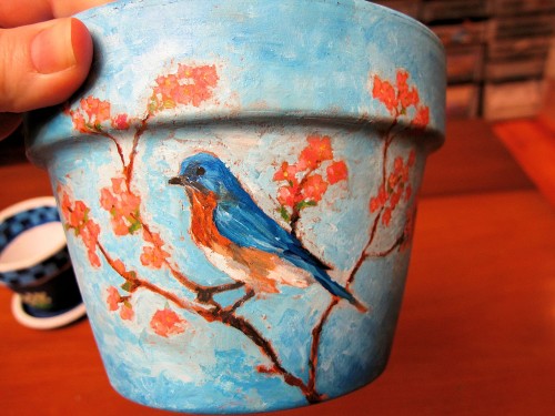 bluebird painted on clay flowerpot