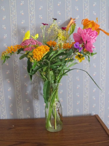My daughter arranged these hot-colored flowers from out backyard into a pleasing bouquet.