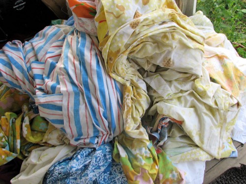 This motley assortment of sheets is stored in the attic and used to cover plants when frost threatens.
